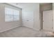 Bedroom featuring carpet, a window, and closet space at 2656 Tillman St, Monroe, NC 28112