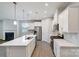 Open kitchen with stainless steel appliances and view of fireplace, window and island at 2656 Tillman St, Monroe, NC 28112