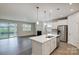 Spacious open floorplan with island, kitchen and outdoor view at 2656 Tillman St, Monroe, NC 28112