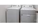 Laundry area featuring a side-by-side washer and dryer with easy-to-use control panels at 2656 Tillman St, Monroe, NC 28112