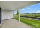 Screened in patio offering a peaceful outdoor space overlooking the manicured backyard and serene green field at 2656 Tillman St, Monroe, NC 28112