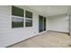 Covered patio with a view of the backyard, enhanced by natural light from the adjacent windows at 2656 Tillman St, Monroe, NC 28112