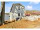 Backyard view with a white-sided house and lake access at 3113 South Point Rd, Belmont, NC 28012