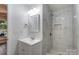 Charming bathroom featuring modern fixtures, vanity sink, and a tiled walk-in shower at 313 Villa St, Kannapolis, NC 28083