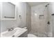 Modern bathroom featuring marble tile shower and mosaic tile floors at 313 Villa St, Kannapolis, NC 28083