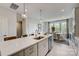 Spacious kitchen with a large island, modern lighting, and an adjacent dining area at 3210 Stelfox St, Charlotte, NC 28262