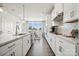 Modern kitchen featuring stainless steel appliances, ample cabinet space, and an adjacent dining area at 3218 Stelfox St, Charlotte, NC 28262