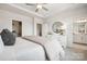 Calm main bedroom with a dresser, bedside table, and a view to the main bath and walk-in closet at 3218 Stelfox St, Charlotte, NC 28262