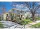 Charming two-story home with a covered front porch and manicured landscaping on a sunny day at 324 Wendover Hill Ct, Charlotte, NC 28211