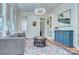 Bright living room with hardwood floors, a grey sofa, and a large window at 324 Wendover Hill Ct, Charlotte, NC 28211