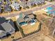 Stunning aerial view of a craftsman home featuring a landscaped yard, screened porch, and fire pit at 388 Luray Way, Rock Hill, SC 29730
