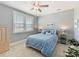 Bedroom with a ceiling fan, window with blinds, blue bedding and carpet at 388 Luray Way, Rock Hill, SC 29730