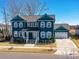 Charming two-story craftsman home with a inviting front porch, manicured lawn, and a two-car garage at 388 Luray Way, Rock Hill, SC 29730