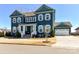 Attractive two-story home with white trim, shutters, well-maintained yard and a detached garage at 388 Luray Way, Rock Hill, SC 29730