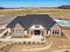 Attractive community clubhouse exterior featuring brick and stone facade, lush landscaping, and ample parking at 388 Luray Way, Rock Hill, SC 29730