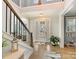 Inviting foyer with wood floors, staircase, and plenty of natural light at 388 Luray Way, Rock Hill, SC 29730