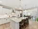 Bright, open kitchen with island, white cabinets, and modern appliances at 388 Luray Way, Rock Hill, SC 29730