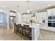 Bright kitchen boasts a large island, stainless steel appliances, and pendant lighting at 388 Luray Way, Rock Hill, SC 29730