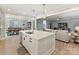 Open-concept kitchen with center island, stainless steel dishwasher, and views of the living and dining areas at 388 Luray Way, Rock Hill, SC 29730