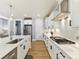 Modern kitchen features white cabinets, stainless steel appliances, and a center island with sink at 388 Luray Way, Rock Hill, SC 29730