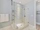 White tiled standing shower with glass doors at 388 Luray Way, Rock Hill, SC 29730