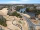 Scenic aerial view of a golf course and lake, showcasing the community's natural beauty and amenities at 4030 Ambleside Dr, Fort Mill, SC 29707