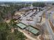 Aerial view of community clubhouse, tennis courts, and extensive parking, perfect for active residents at 4030 Ambleside Dr, Fort Mill, SC 29707