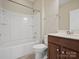 Bathroom with a shower-tub, toilet, and vanity with wood cabinets at 4030 Ambleside Dr, Fort Mill, SC 29707