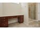 Bathroom features custom vanity with drawers and granite counters, adjacent to glass shower at 4030 Ambleside Dr, Fort Mill, SC 29707