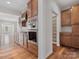 Kitchen featuring stainless appliances and wood cabinets, with a pantry in the background at 4030 Ambleside Dr, Fort Mill, SC 29707