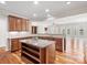 Well-appointed kitchen featuring granite countertops, a center island, and hardwood floors at 4030 Ambleside Dr, Fort Mill, SC 29707