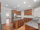 Well-lit kitchen featuring granite counters, stainless steel appliances, and hardwood flooring at 4030 Ambleside Dr, Fort Mill, SC 29707