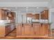 Open concept kitchen with a large island, stainless appliances, and wood cabinetry at 4030 Ambleside Dr, Fort Mill, SC 29707