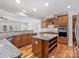 Modern kitchen with granite countertops, stainless steel appliances, and custom cabinetry at 4030 Ambleside Dr, Fort Mill, SC 29707