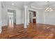 Open-concept living room with hardwood floors, tray ceilings, and abundant natural light at 4030 Ambleside Dr, Fort Mill, SC 29707