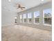 Bright, open living room with tile flooring, neutral walls, and large windows offering natural light at 4030 Ambleside Dr, Fort Mill, SC 29707