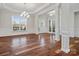 Bright living room with hardwood floors, decorative columns, and a large window at 4030 Ambleside Dr, Fort Mill, SC 29707