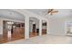 Open concept living space with archways, hardwood floors, fireplace and built-in shelving at 4030 Ambleside Dr, Fort Mill, SC 29707