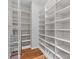 Walk-in pantry with white shelving and wire baskets for optimal storage at 4030 Ambleside Dr, Fort Mill, SC 29707