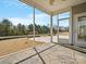 Screened-in porch with stone flooring offering a serene outdoor retreat with view of backyard at 4030 Ambleside Dr, Fort Mill, SC 29707