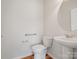 Neat powder room featuring a pedestal sink, brushed nickel fixtures, and a round mirror at 4030 Ambleside Dr, Fort Mill, SC 29707