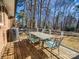 The back deck is equipped with a grill and table with chairs for outdoor entertaining at 4455 Hampton Rd, Salisbury, NC 28144