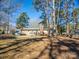 Expansive backyard surrounded by mature trees, offering a private and natural setting at 4455 Hampton Rd, Salisbury, NC 28144