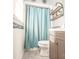 Cozy bathroom featuring a vanity, toilet, and shower with a blue curtain at 4455 Hampton Rd, Salisbury, NC 28144