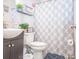Cozy bathroom featuring a vanity, toilet, and shower with a patterned curtain at 4455 Hampton Rd, Salisbury, NC 28144