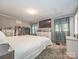 Primary bedroom with neutral colors, white furnishings and natural light at 4455 Hampton Rd, Salisbury, NC 28144
