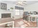 Open-concept dining area with a brick fireplace, ceiling fan, and a convenient workspace at 4455 Hampton Rd, Salisbury, NC 28144