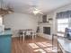 Spacious dining area featuring a white brick fireplace, desk, and wood-look flooring at 4455 Hampton Rd, Salisbury, NC 28144