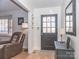 Inviting entryway featuring parquet floors, a black front door and stylish decor at 4455 Hampton Rd, Salisbury, NC 28144