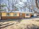 Inviting single-story home with a brick facade, charming shutters, and a convenient carport at 4455 Hampton Rd, Salisbury, NC 28144